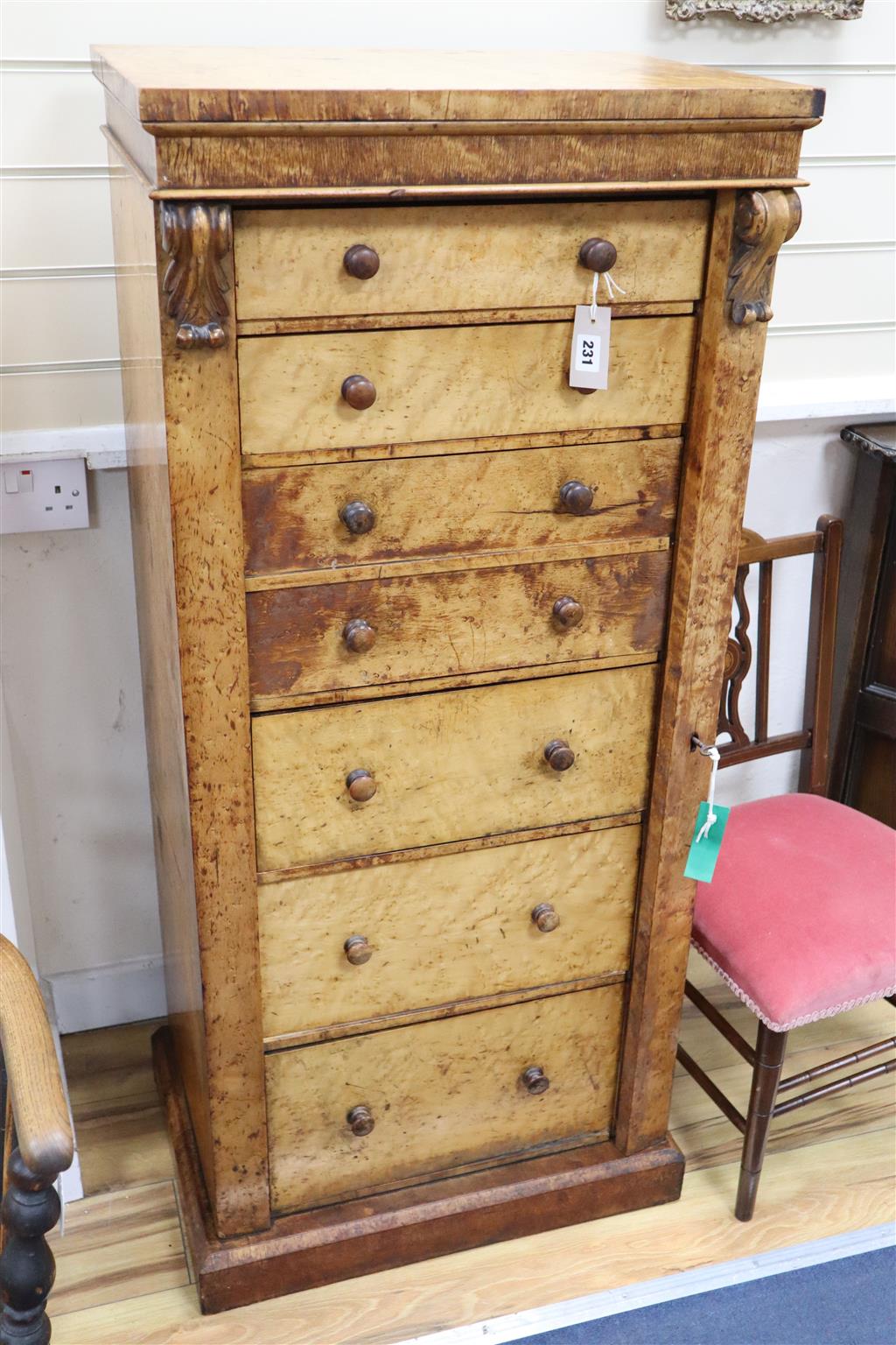 A Victorian birds eye maple secretaire Wellington chest, by Druce 7 Co., width 56cm, depth 40cm, height 127cm